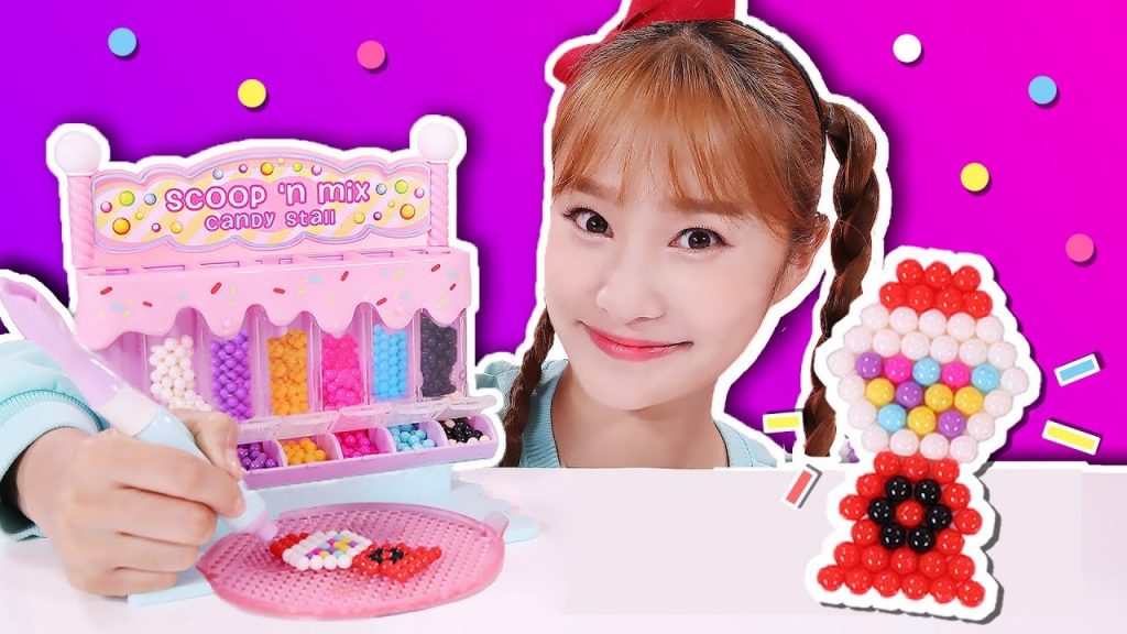 花花綠綠的珠子用神奇筆製作水粘珠點滴畫小製作遊戲-基尼